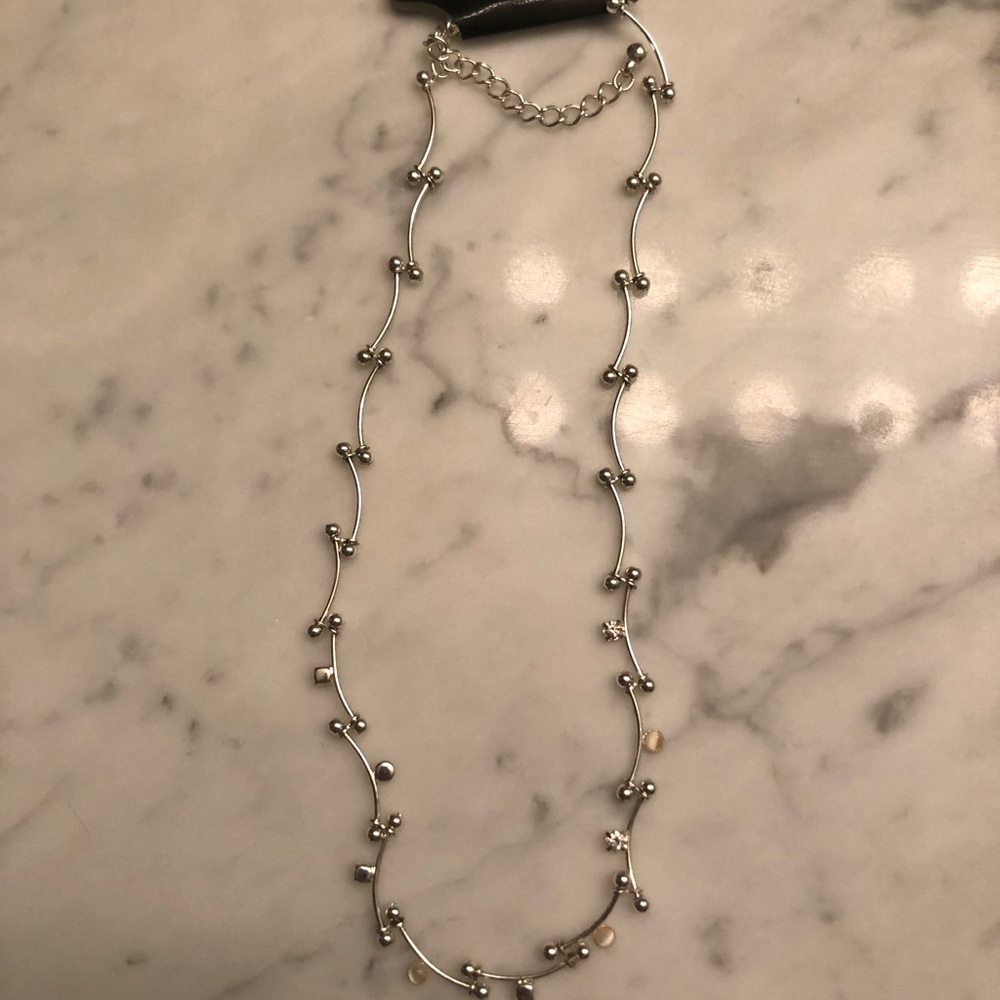 Silver necklace.
